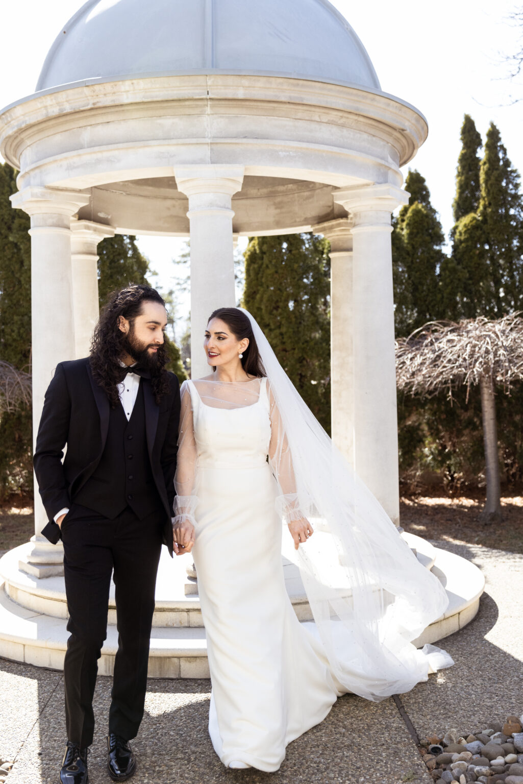 Bride and Groom walking down aisle in Madi Lane Dress