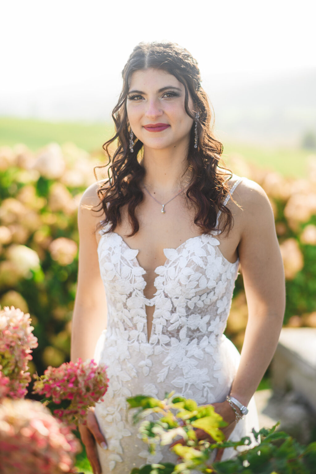 Bride wearing Madi Lane Bridal gown to her wedding