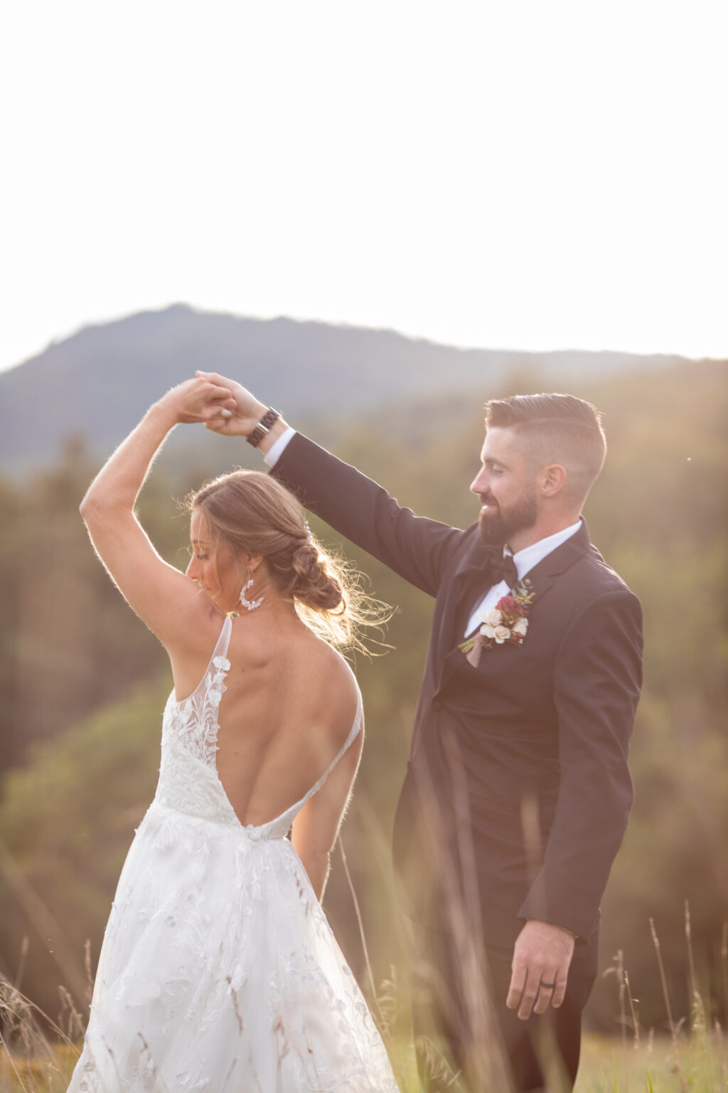 Bride in Madi Lane Dress name harper spinning in field