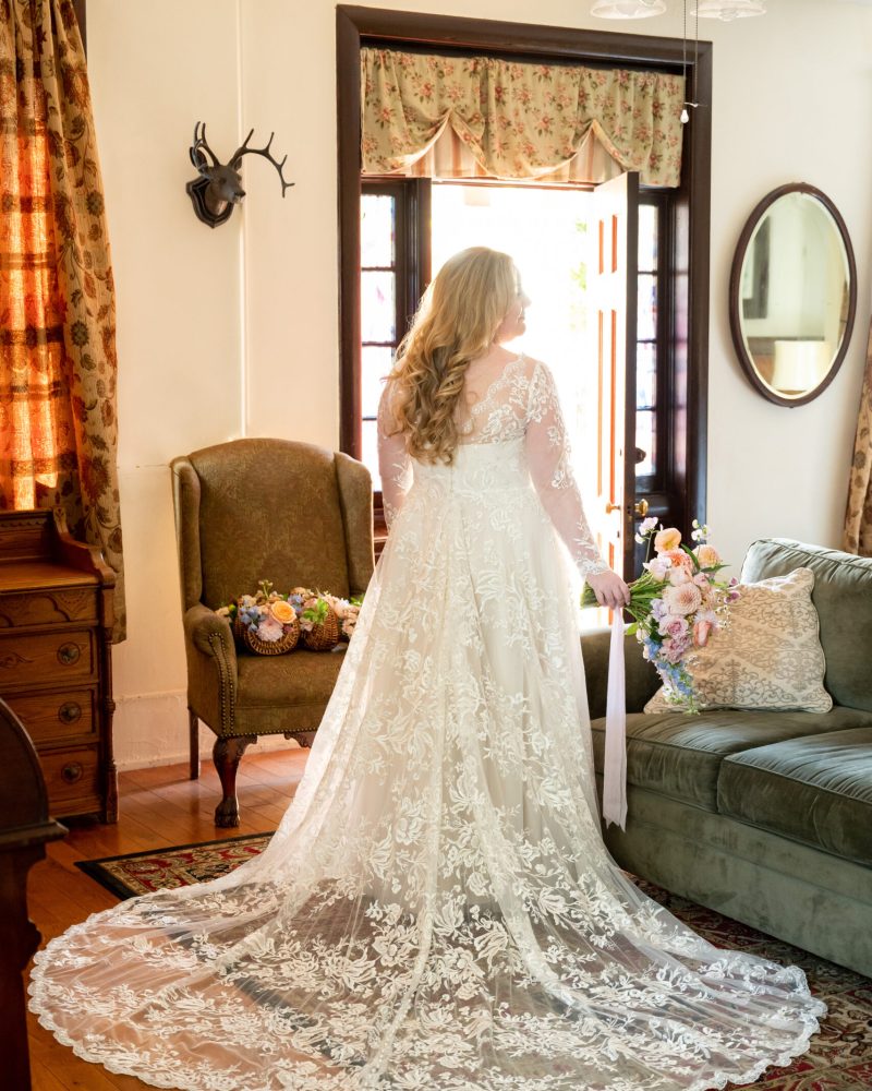 Bride in long sleeve studio levana gown